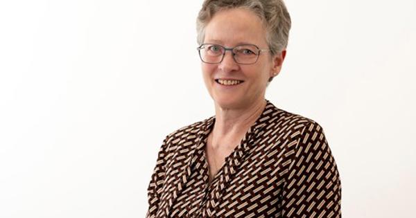 Headshot of Karen Mitchell wearing a dot shirt