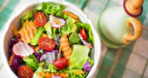 a salad in a bow on a table
