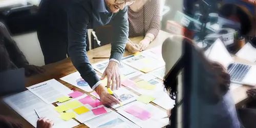 group of people planning with paper 