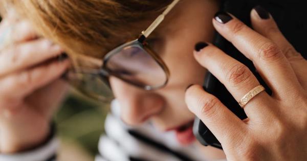 concerned woman speaking on mobile phone