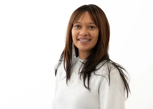headshot of Paula King wearing a white shirt