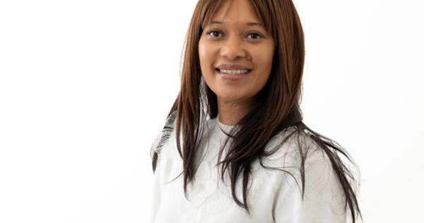 headshot of Paula King wearing a white shirt