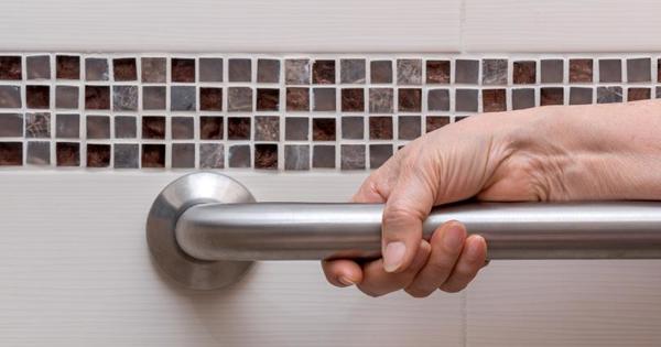 Rail In Bathroom with hand on the side